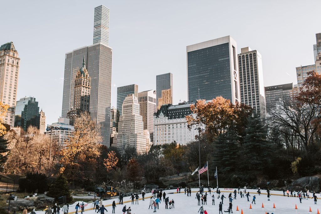 Wollman Rink ice skating Central Park skyline