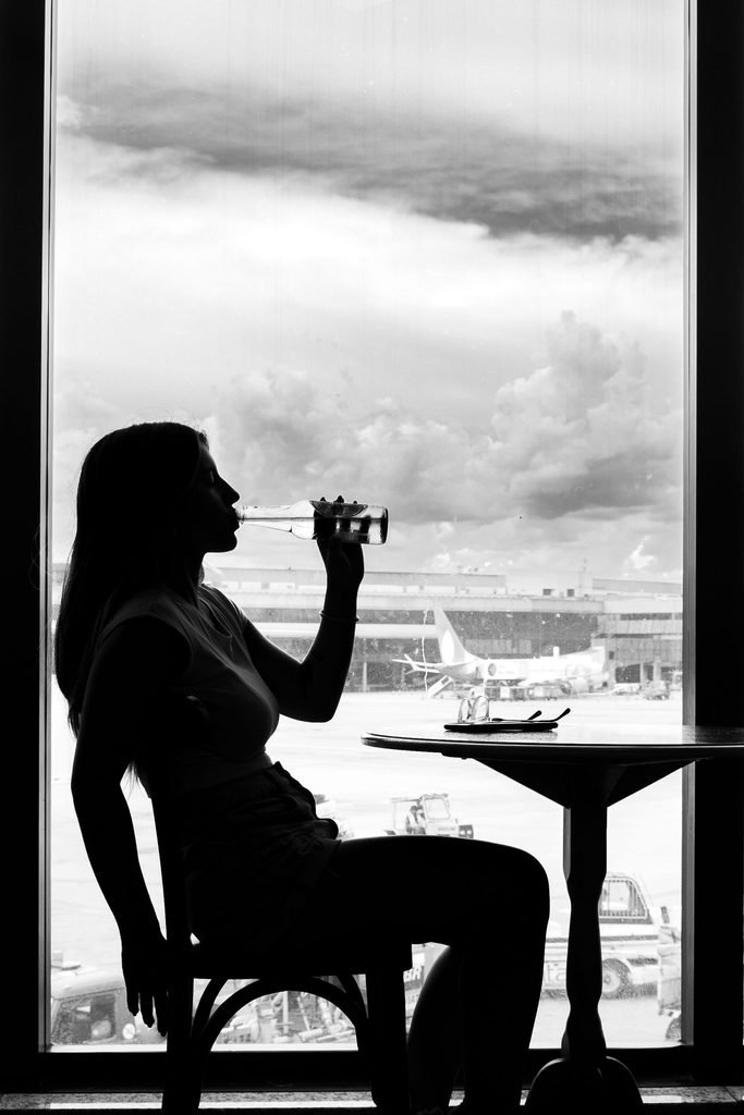 Traveler relaxing in an airport lounge before a New York flight