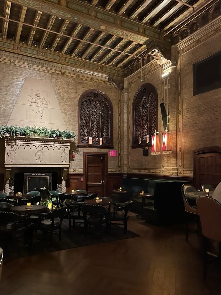 Painted ceiling and stone fireplace inside The Campbell at Grand Central