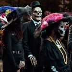 Crowds and giant puppets at the Village Halloween Parade near boutique hotels in NYC