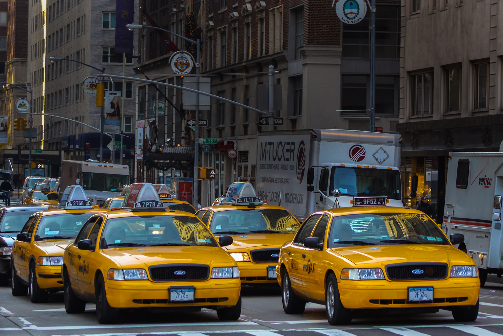 A line of yellow taxis waiting on a Manhattan street