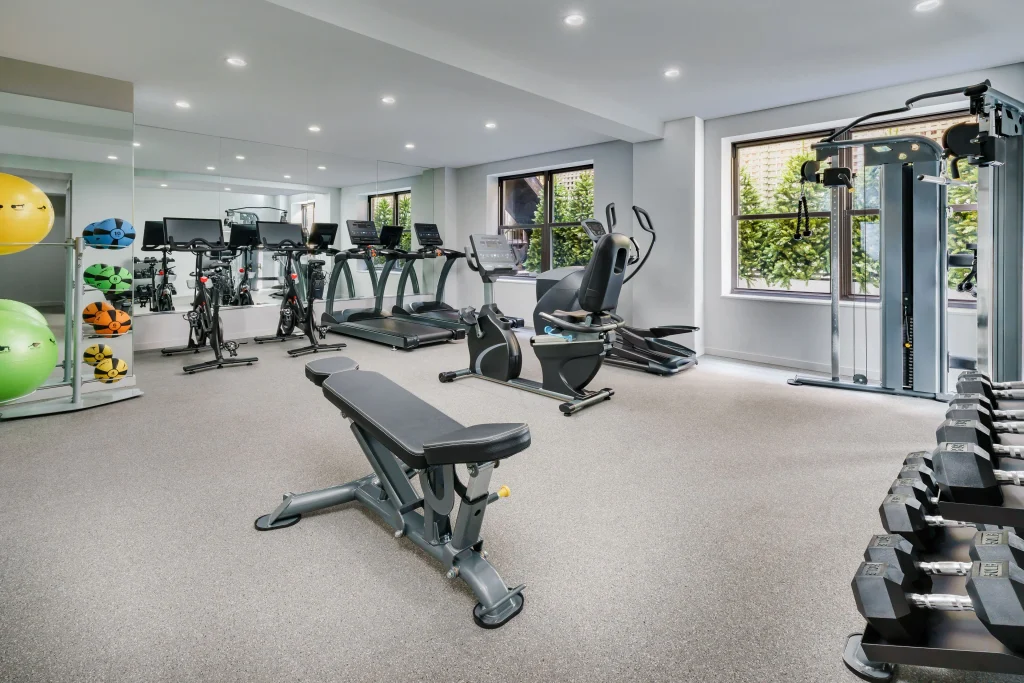 The Wallace Hotel gym on the Upper West Side with cardio equipment and Peloton bikes