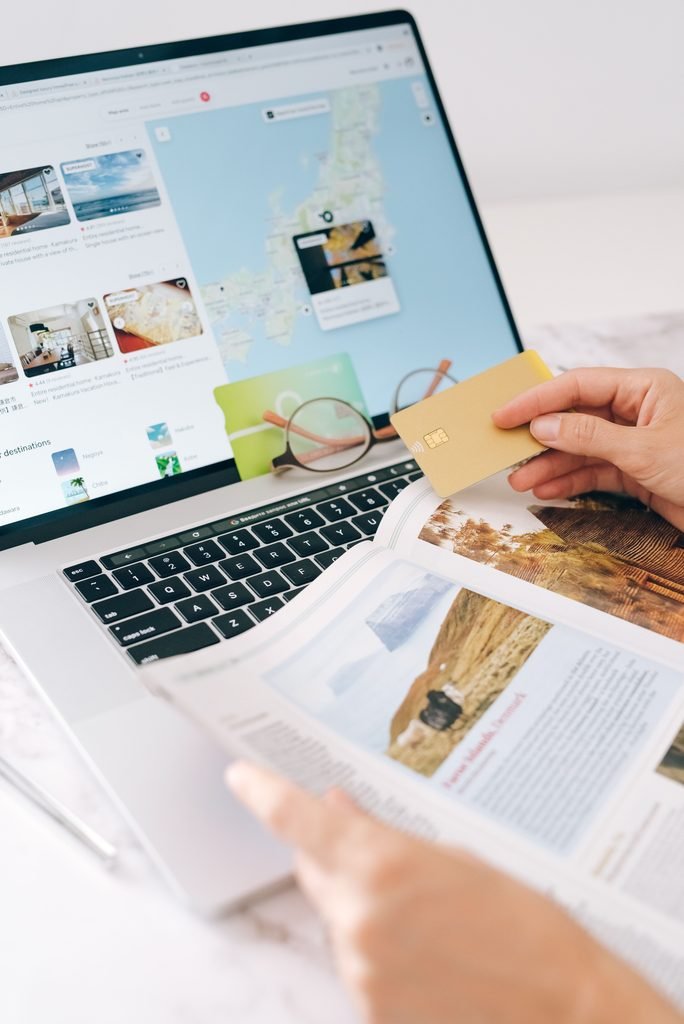 Passport, laptop and credit cards laid out for planning an award flight